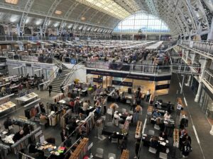 a photo of the london textile fair taken from inside of the venue with reflections on the ceiling